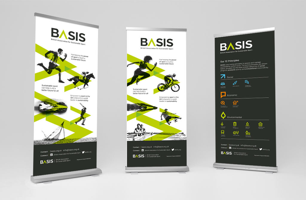 Three roller banners printed on sustainable materials on a blank background. Branded designs by ID Creative Design for BASIS showcasing their cause for events.
