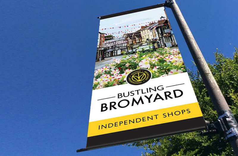 Historic market town high street in Herefordshire illustration printed onto a roadside banner in Bromyard to promote their independent shops.