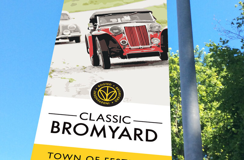 Classic car illustration printed onto a roadside banner in Bromyard to promote their festivals.